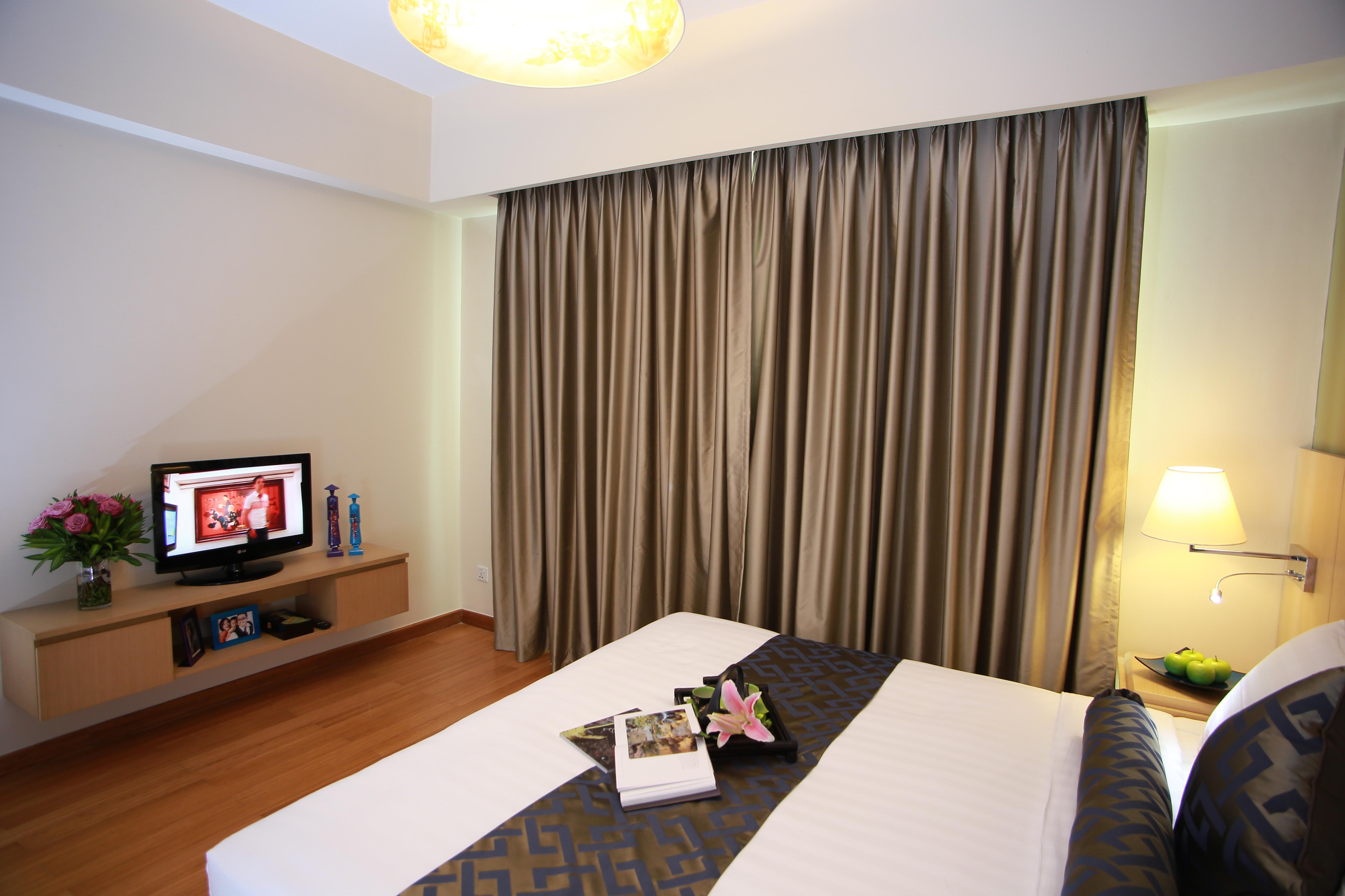 胡志明市萨默塞特酒店 外观 照片 A bedroom at the hotel